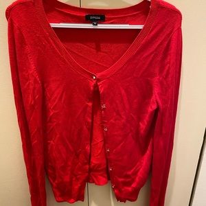 Express red cardigan with diamond-like buttons